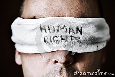 Young man with a blindfold with the text human rights Stock Photo