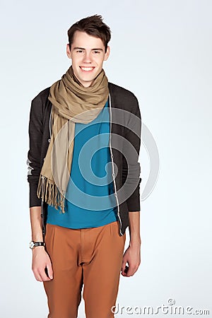 Young man in blue tanktop and scarf isolated on white background Stock Photo