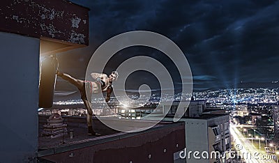 Young man boxing training , on top of the house above the city Stock Photo