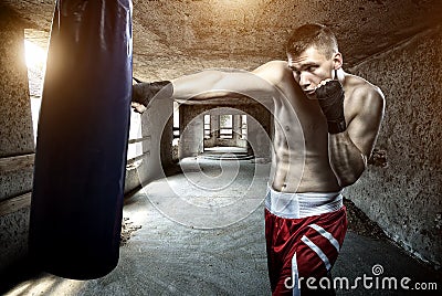 Young man boxing workout in an old building Stock Photo