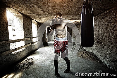 Young man boxing workout in an old building Stock Photo