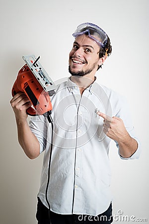 Young man bricolage working with electric saw Stock Photo