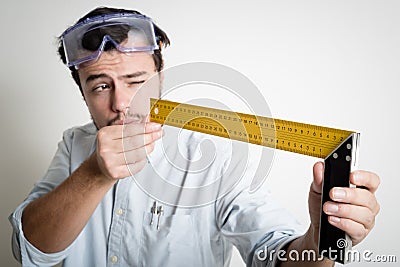 Young man bricolage working measuring with meter Stock Photo