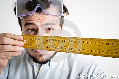 Young man bricolage working measuring with meter Stock Photo