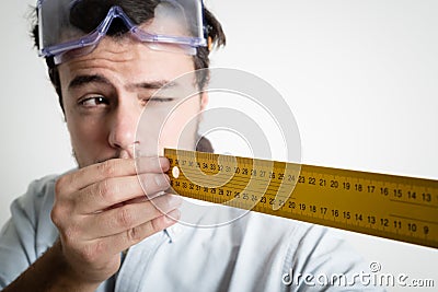 Young man bricolage working measuring with meter Stock Photo