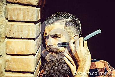 Hipster cutting with razor Stock Photo