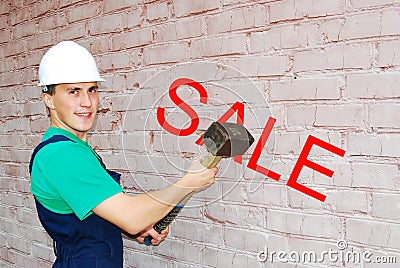 Young man in a builder uniform. Stock Photo