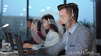 Young man in call center Stock Photo