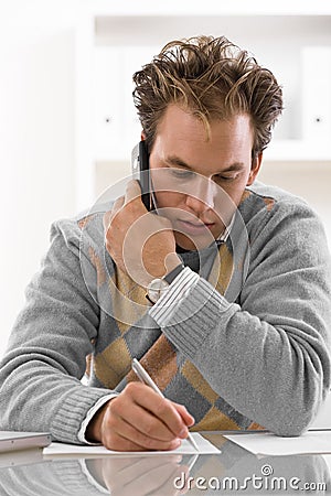 Young man calling on phone Stock Photo