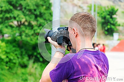 Young man with a camera Stock Photo