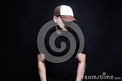 Young Man in Cap. Fashionable Hipster Boy Stock Photo