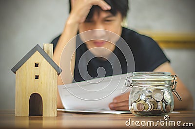 Man checking bills and having financial problems with home debt, Money concept., real estate, buy an apartment Stock Photo