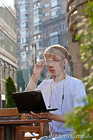 Young man checking mail in cafe Stock Photo