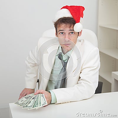 Young man with christmas hat and premium Stock Photo