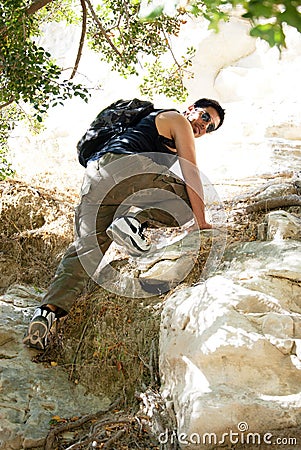 Young man climbing Stock Photo