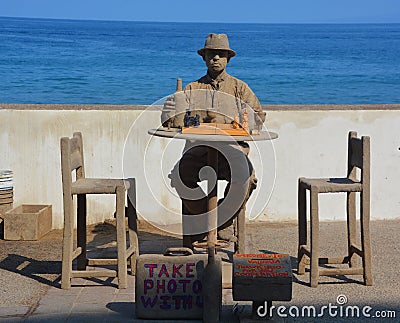 Young man cover of sand play chess game Editorial Stock Photo