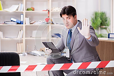 The young man during crime investigation in office Stock Photo