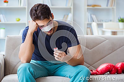 Young man defeated in sports game suffered loss with broken blee Stock Photo