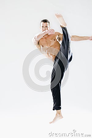 Young man demonstrating kick Stock Photo