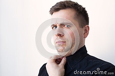 Young man with a double chin in black t-shirt. Stock Photo