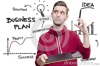 Young man with drawing pad and pen imagining business plan. Stock Photo