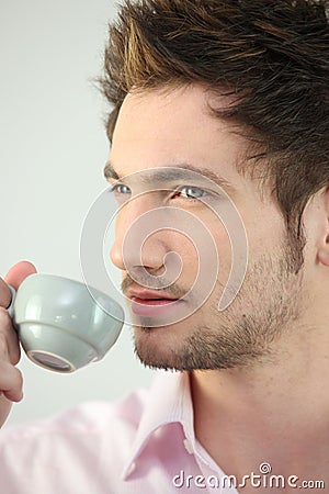 Young man drinking espresso Stock Photo