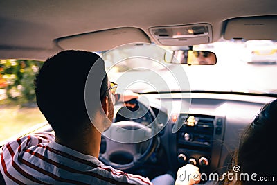 Young man driving around town Stock Photo