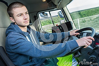 Young man driving lorry Stock Photo