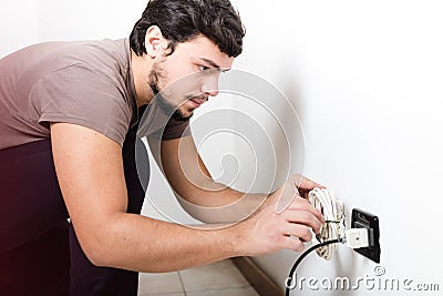 Young man electrician bricolage working Stock Photo