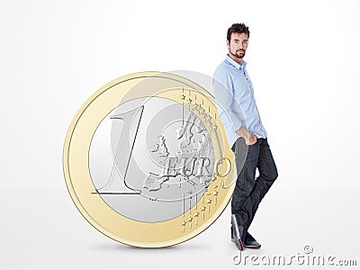 Young man endorsed on a big one euro coin Stock Photo