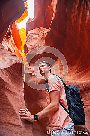Young man exploring Antelope Canyon in the Navajo Stock Photo