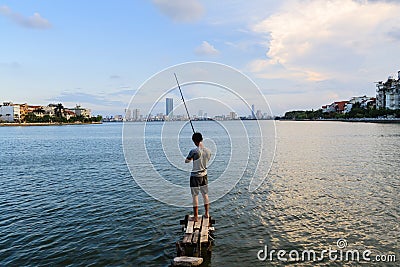 Young man fishing on west lake Editorial Stock Photo