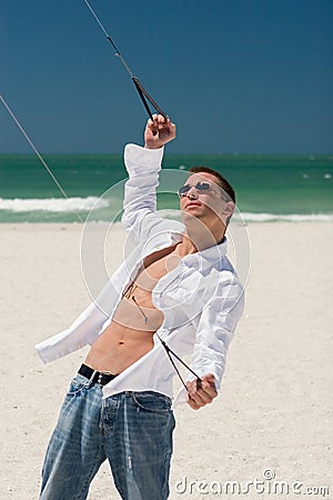 Young Man Flying a Stunt Kite Stock Photo