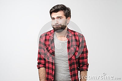 Young man frowning face in displeasure, he lost his voice from surprise Stock Photo