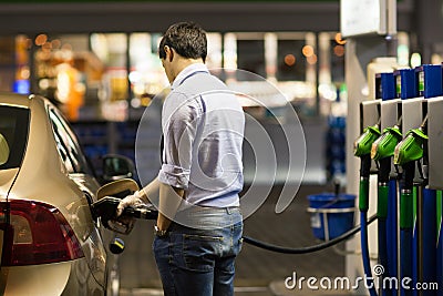 Young man fueling his car Stock Photo