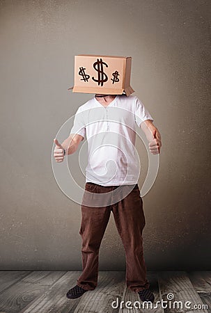 Young man gesturing with a cardboard box on his head with dollar Stock Photo