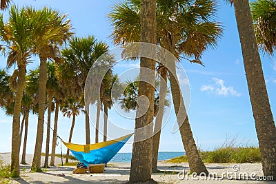 Young man and girl in hammock in beautiful beach Stock Photo