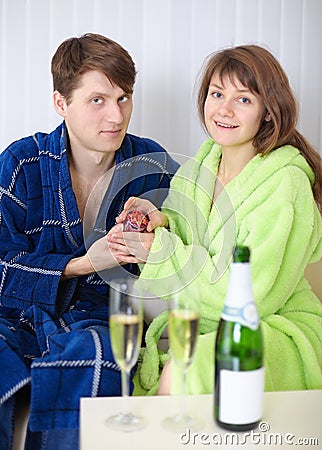 Young man gives a girl a gift Stock Photo