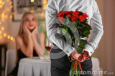 Young man going to make proposal in restaurant Stock Photo