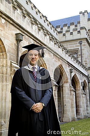 A young man in a graduation gown. Stock Photo