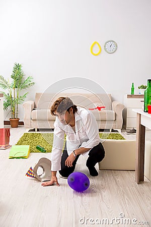 The young man having hangover after party Stock Photo