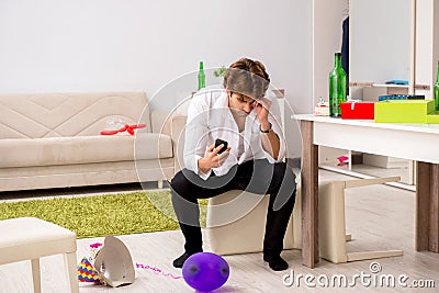 The young man having hangover after party Stock Photo