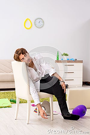 Young man having hangover after party Stock Photo