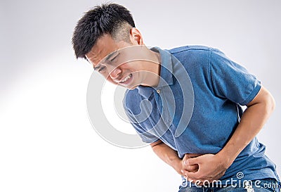 Young man having a stomachache Stock Photo