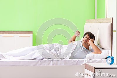 The young man having trouble waking up in early morning Stock Photo