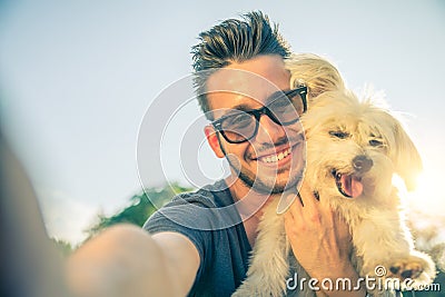 Young man and his dog taking a selfie Stock Photo