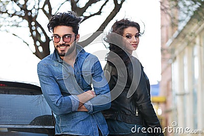 Young man beside his turned woman Stock Photo