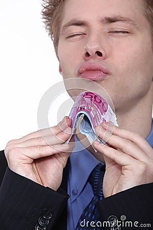 Young man holding bank notes Stock Photo