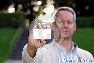 Young man holding a blank business card 2 Stock Photo