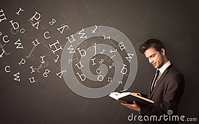 Young man holding book with letters Stock Photo